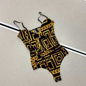 Black and gold bodysuit